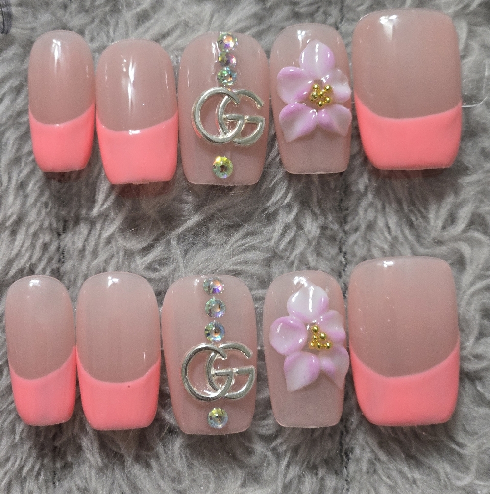 Designer Inspired Pink French Tip Press-On Nails with Floral Accent